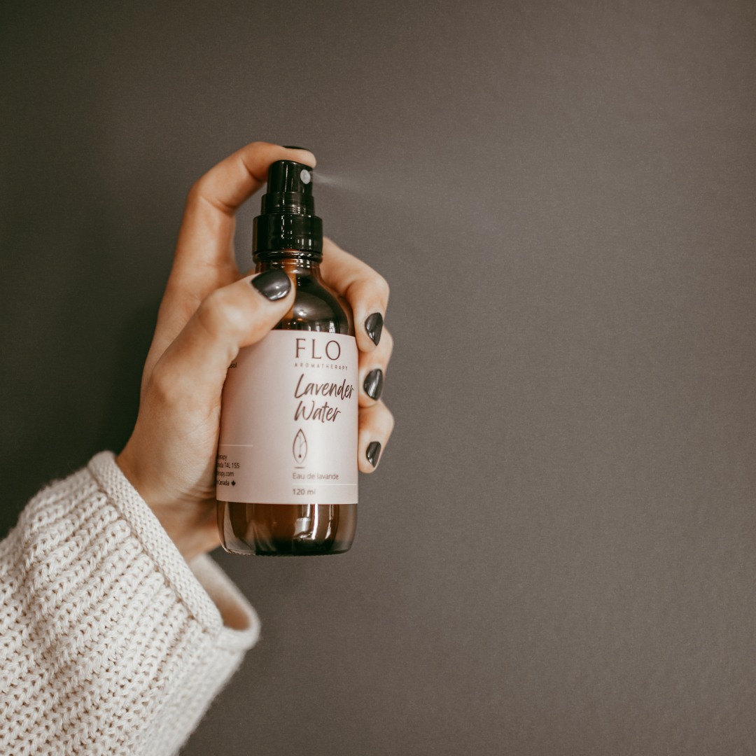 Hand spraying Lavender Water mist for a calming aromatic effect