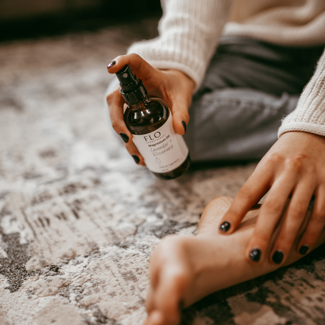 Spraying Magnesium Oil on feet to relax muscles and promote rest