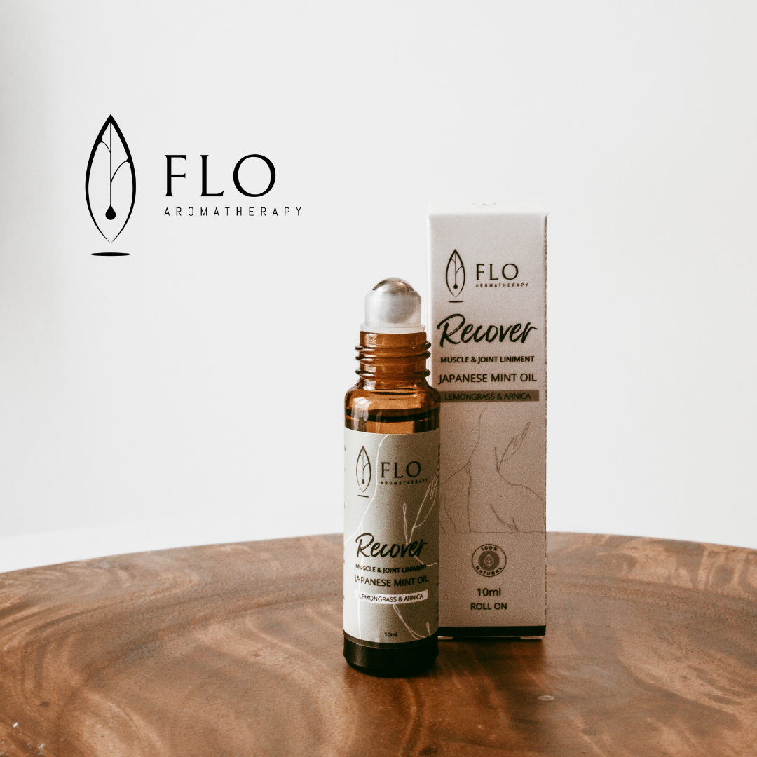 Recovery Liniment Roll-On bottle featuring natural pain relief essential oil blend.