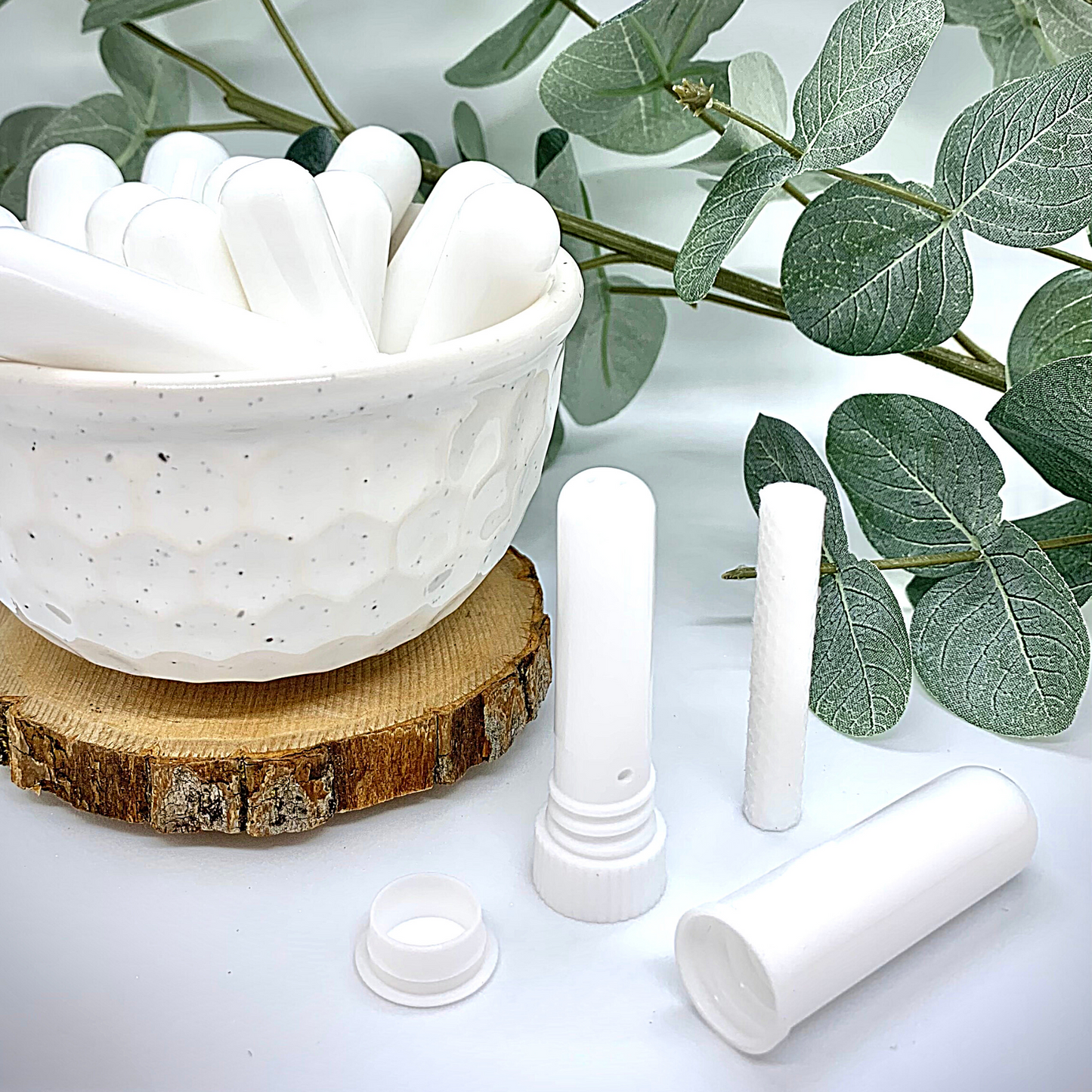 Unscented aroma stick with cap off, showing cotton wick.