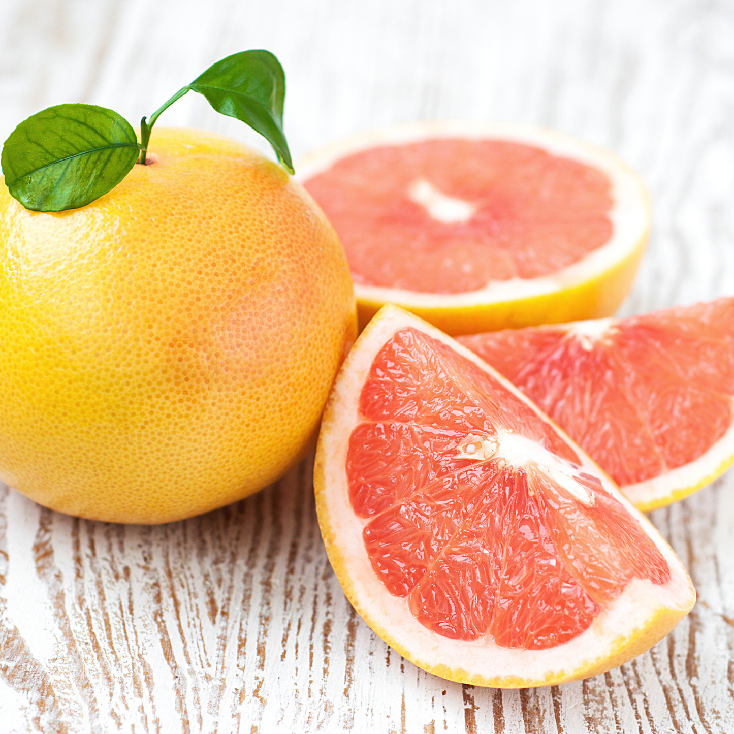 Fresh pink grapefruits—the source of this fruity essential oil.