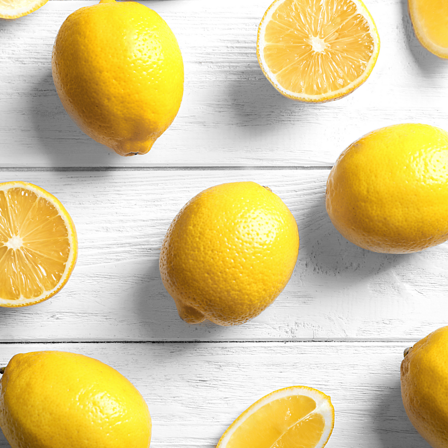 Fresh lemon fruit and plant, symbolizing the pure and natural essence of Lemon Essential Oil.