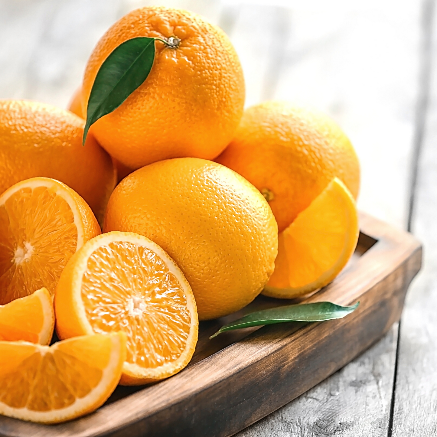 Fresh sweet orange fruit representing the source of Organic Sweet Orange Essential Oil